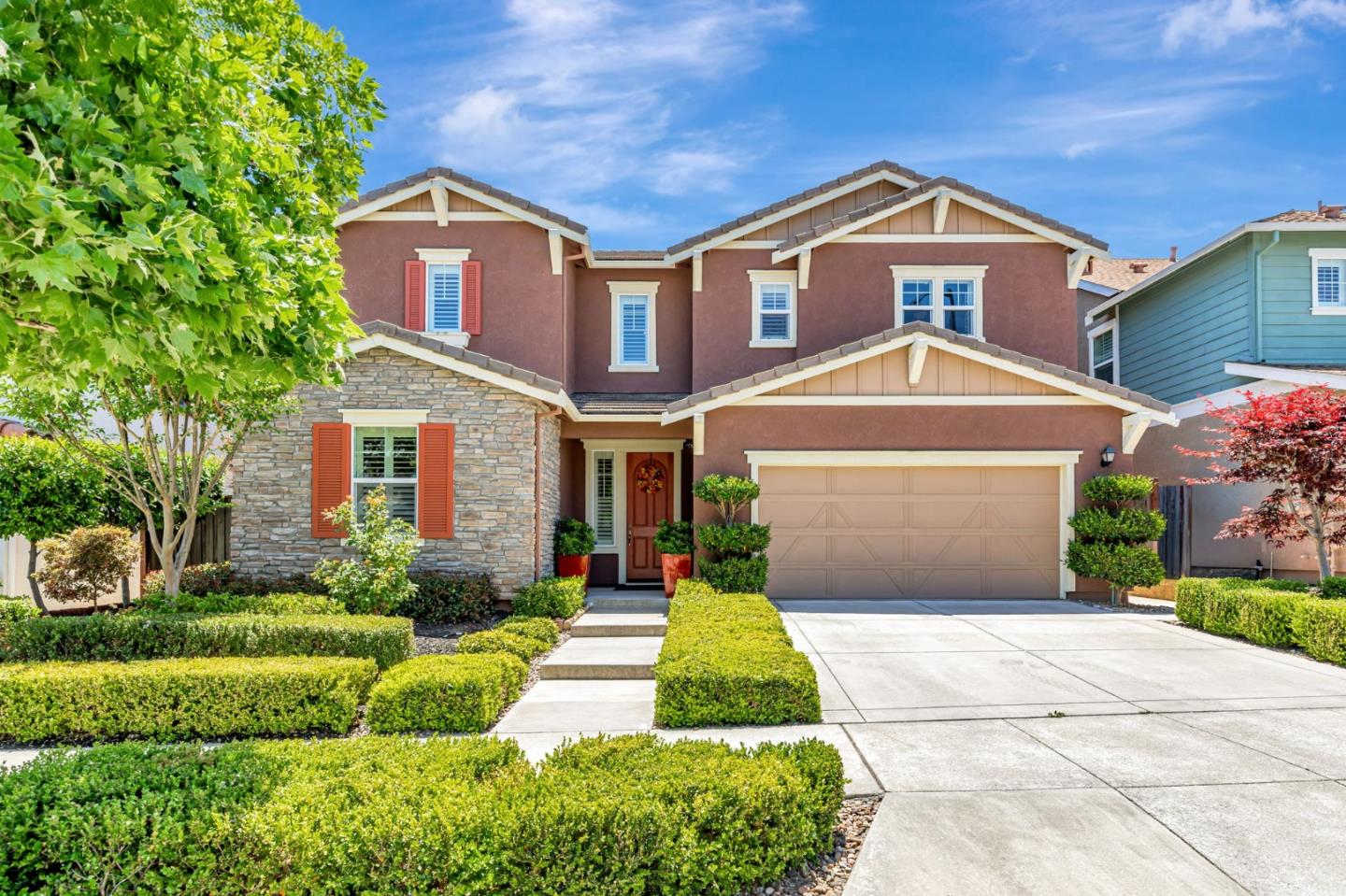 1188 Viognier Way Gilroy, CA 95020 - Photo 2 of 71 a front view of a house with a yard and trees