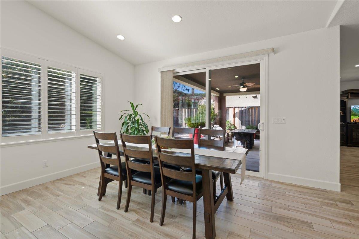 1188 Viognier Way Gilroy, CA 95020 - Photo 21 of 71 a view of a dining room with furniture and wooden floor