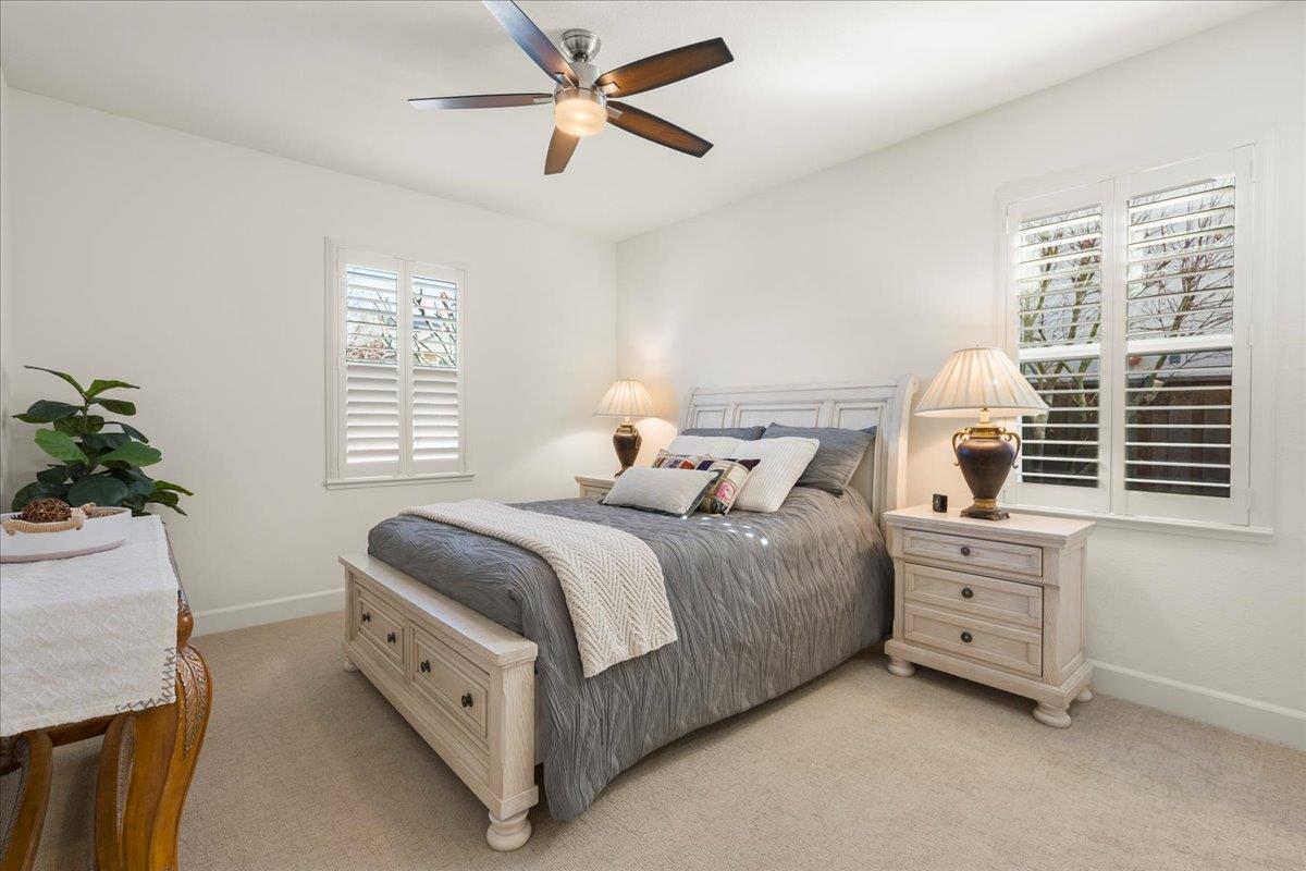1188 Viognier Way Gilroy, CA 95020 - Photo 32 of 71 a spacious bedroom with a bed and a chandelier