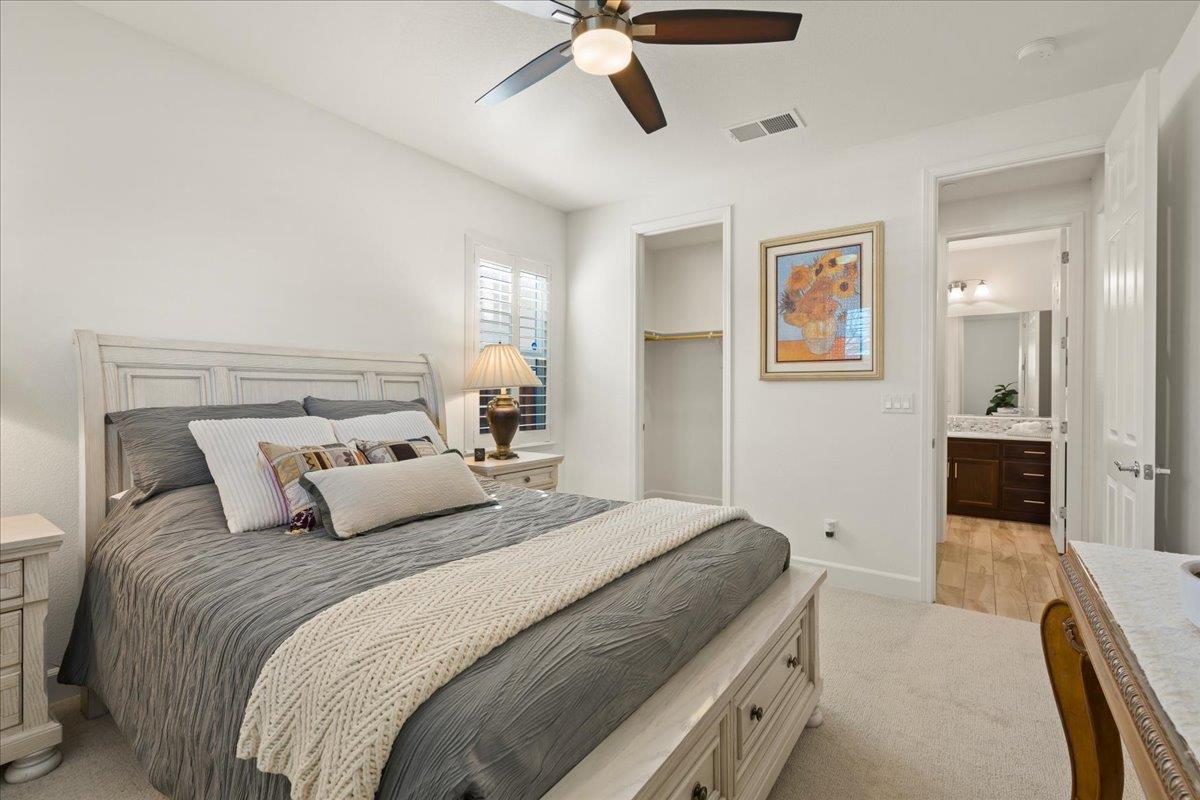 1188 Viognier Way Gilroy, CA 95020 - Photo 33 of 71 a bedroom with a bed and a chandelier