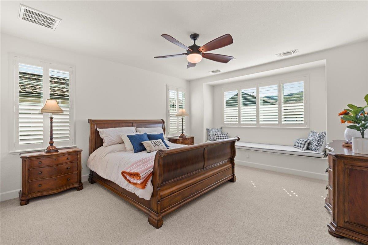 1188 Viognier Way Gilroy, CA 95020 - Photo 39 of 71 a bed room with a bed and a chandelier