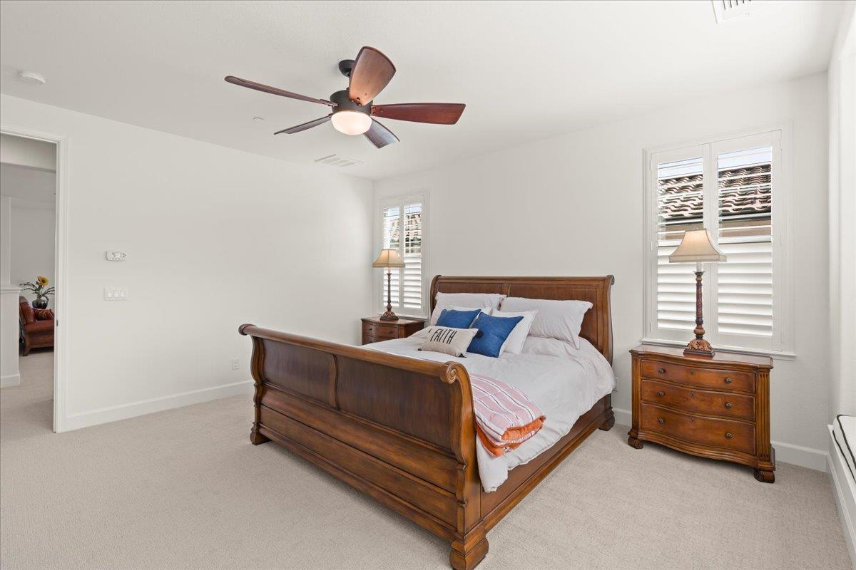 1188 Viognier Way Gilroy, CA 95020 - Photo 41 of 71 a bed room with a bed and a ceiling fan