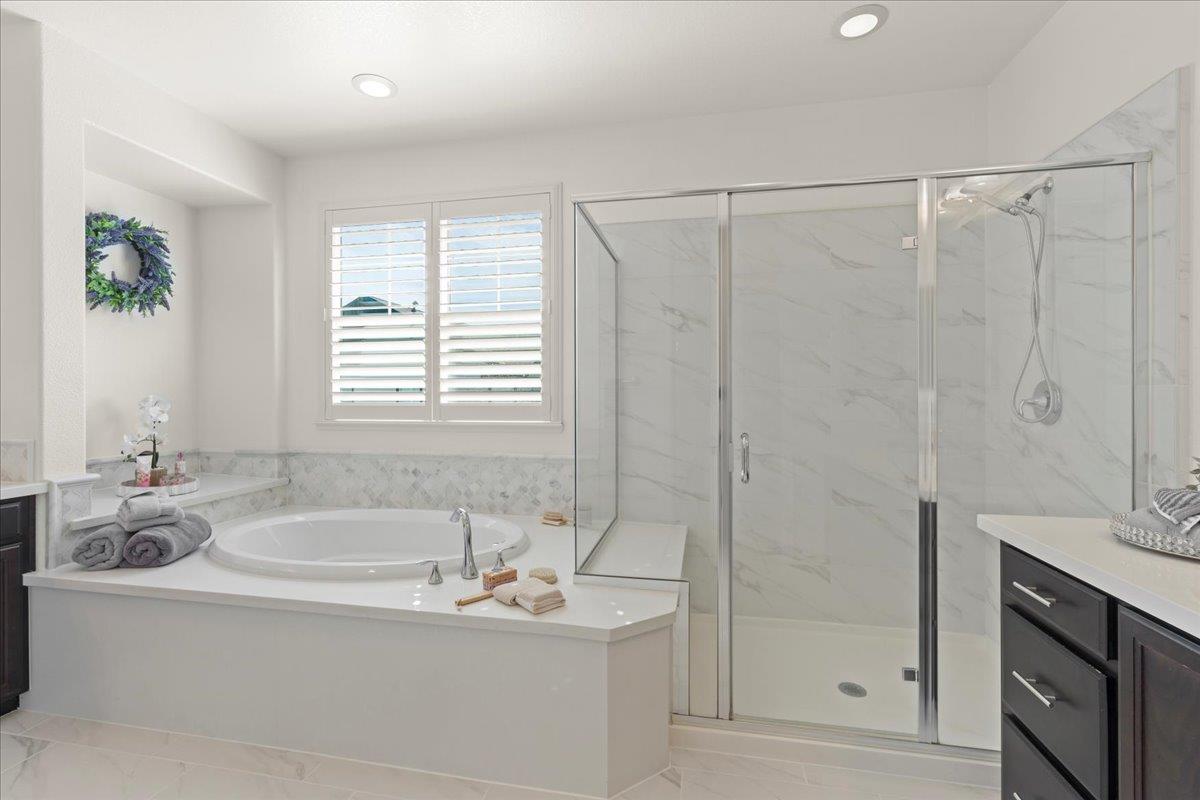 1188 Viognier Way Gilroy, CA 95020 - Photo 46 of 71 a bathroom with a tub a sink a window and a mirror