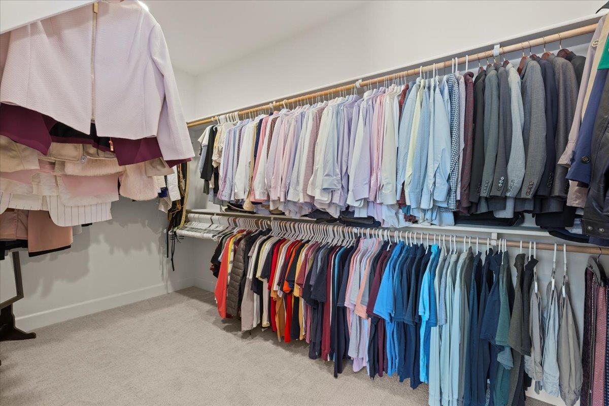 1188 Viognier Way Gilroy, CA 95020 - Photo 49 of 71 a view of walk in closet with clothes and shoes