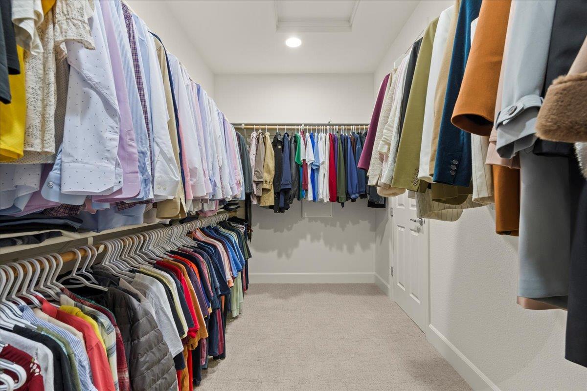 1188 Viognier Way Gilroy, CA 95020 - Photo 50 of 71 a view of walk in closet with clothes and shoes