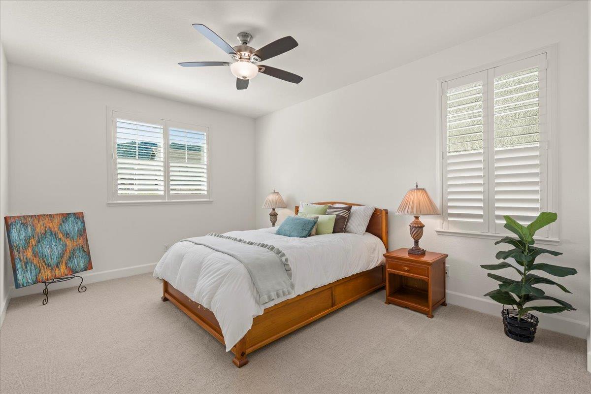 1188 Viognier Way Gilroy, CA 95020 - Photo 57 of 71 a bedroom with a bed and a chandelier