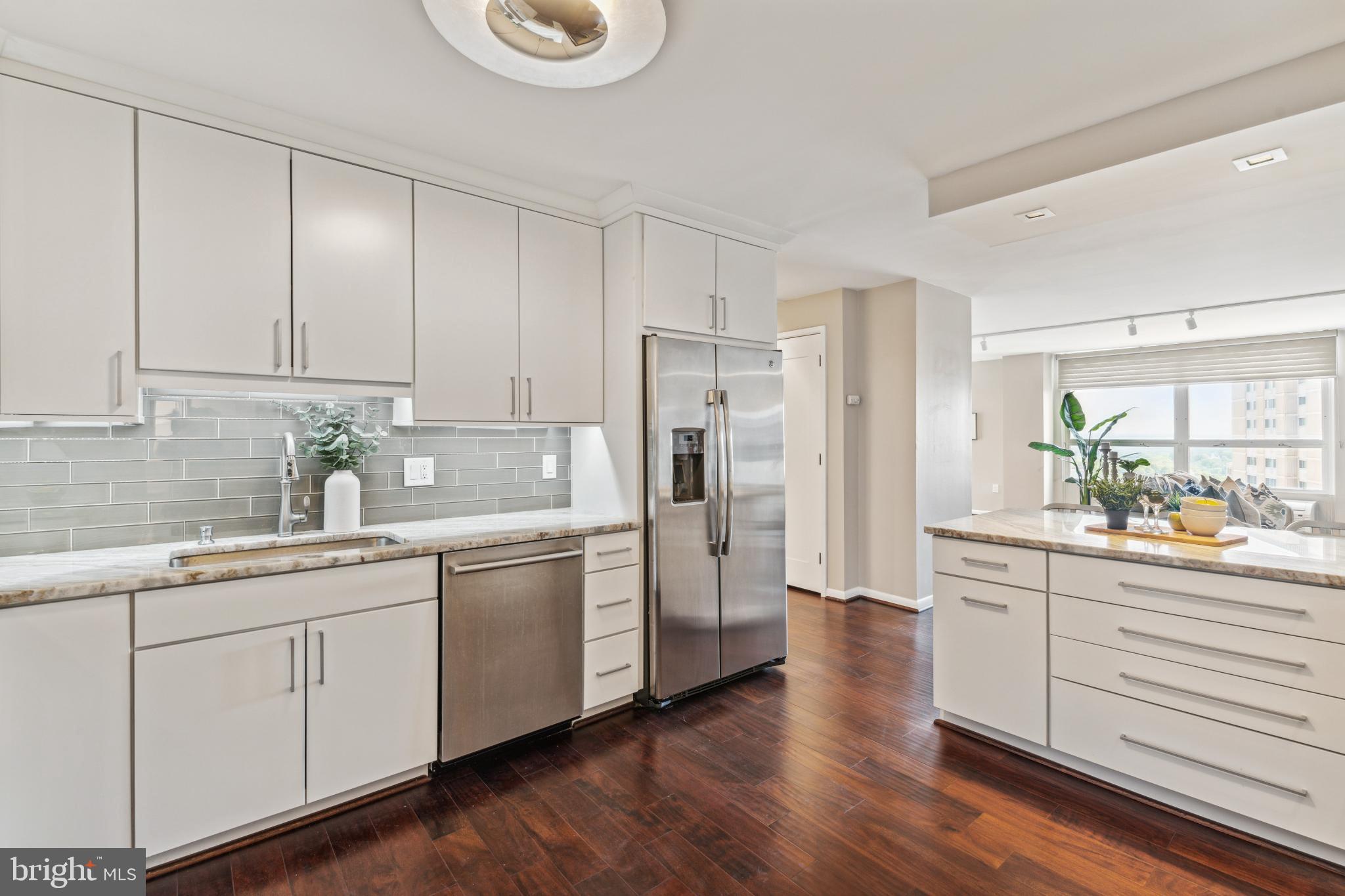 205 East Joppa Road, Unit 2009 Towson, MD 21286 - Photo 6 of 28 Modern kitchen with sleek finishes and light.
