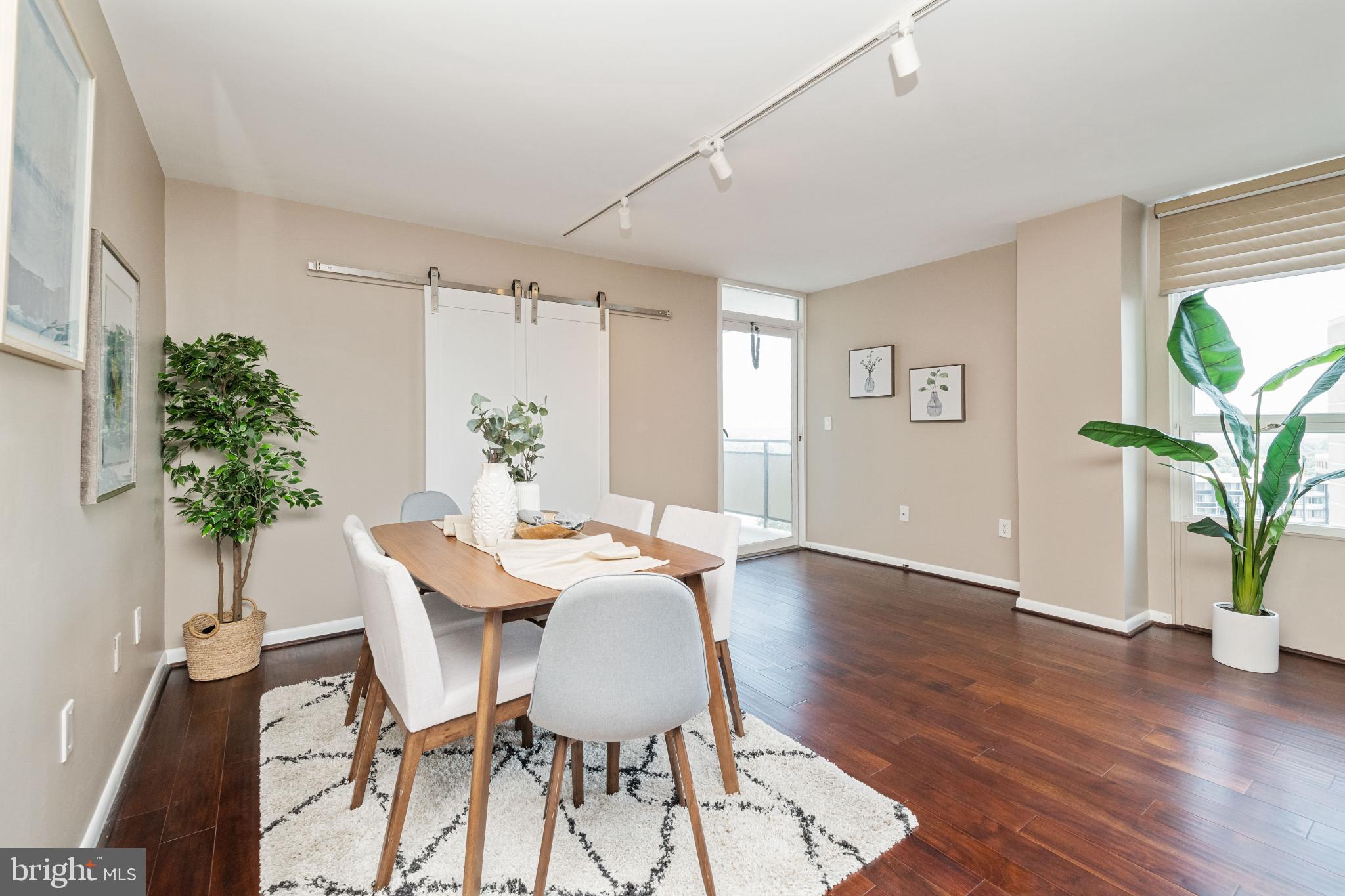 205 East Joppa Road, Unit 2009 Towson, MD 21286 - Photo 8 of 28 Bright and inviting dining space with greenery.