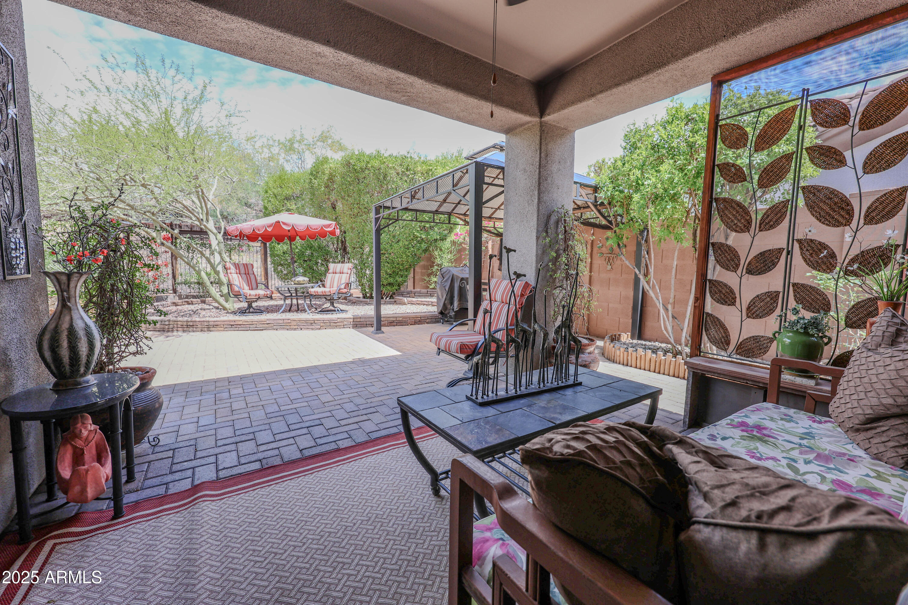 1916 West Spirit Court Anthem, AZ 85086 - Photo 12 of 43 a living room with furniture and a floor to ceiling window