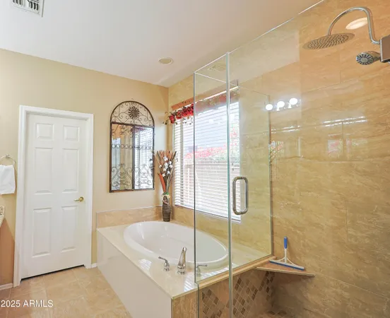 a bathroom with a tub and shower