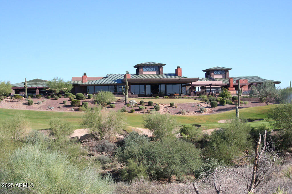 1916 West Spirit Court Anthem, AZ 85086 - Photo 31 of 43 a swimming pool view with a seating space and a garden view