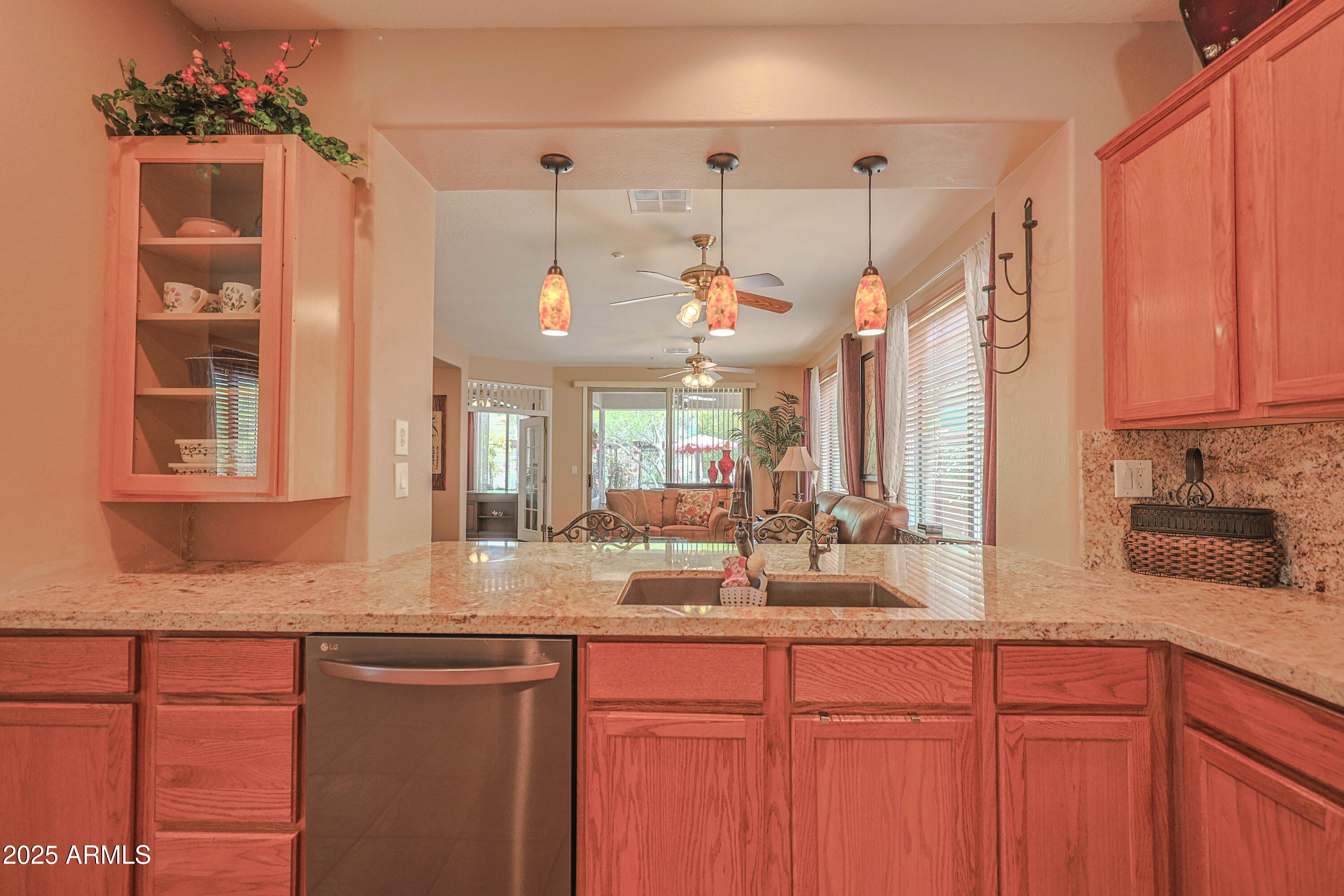 1916 West Spirit Court Anthem, AZ 85086 - Photo 3 of 43 a kitchen with granite countertop a sink cabinets and window