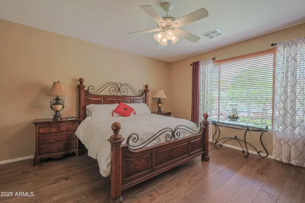 a bed sitting in a bedroom next to a window