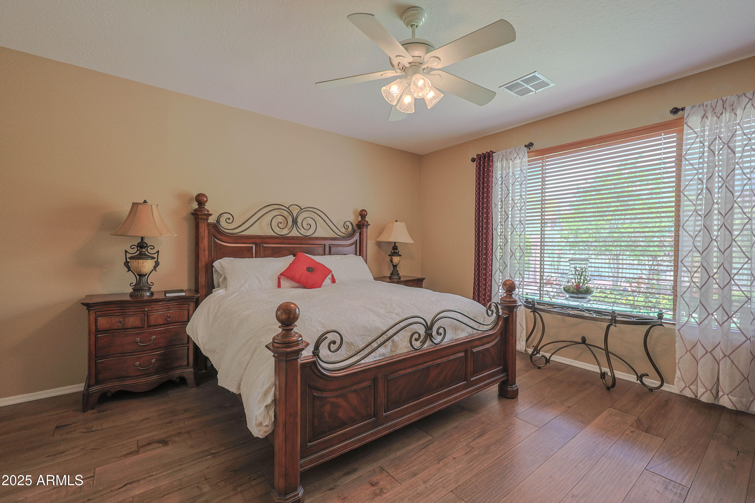 1916 West Spirit Court Anthem, AZ 85086 - Photo 6 of 43 a bed sitting in a bedroom next to a window