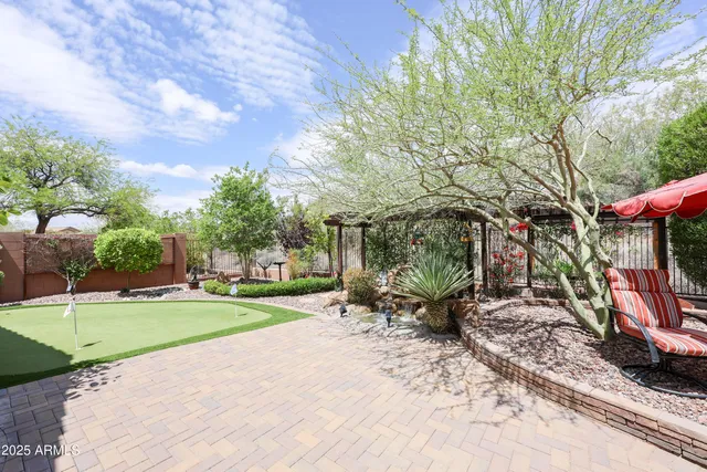 a view of a park with swings and slides
