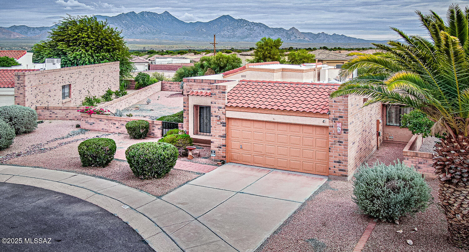 931 West Rio Guaymas Green Valley, AZ 85614 - Photo 38 of 39 a front view of a house with garden