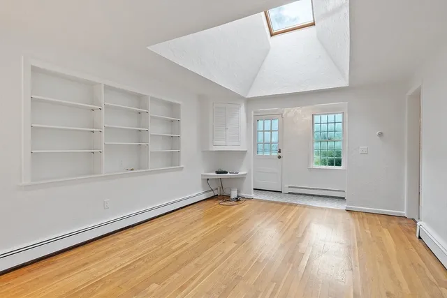 a bed room with a bed and a window