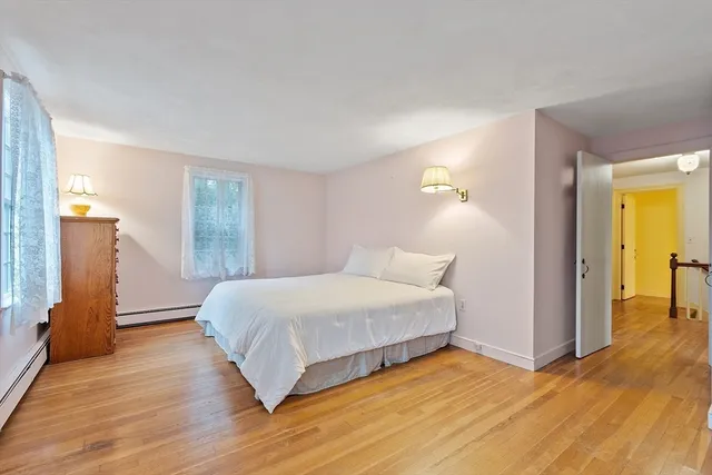 a large bed sitting in a bedroom and closet