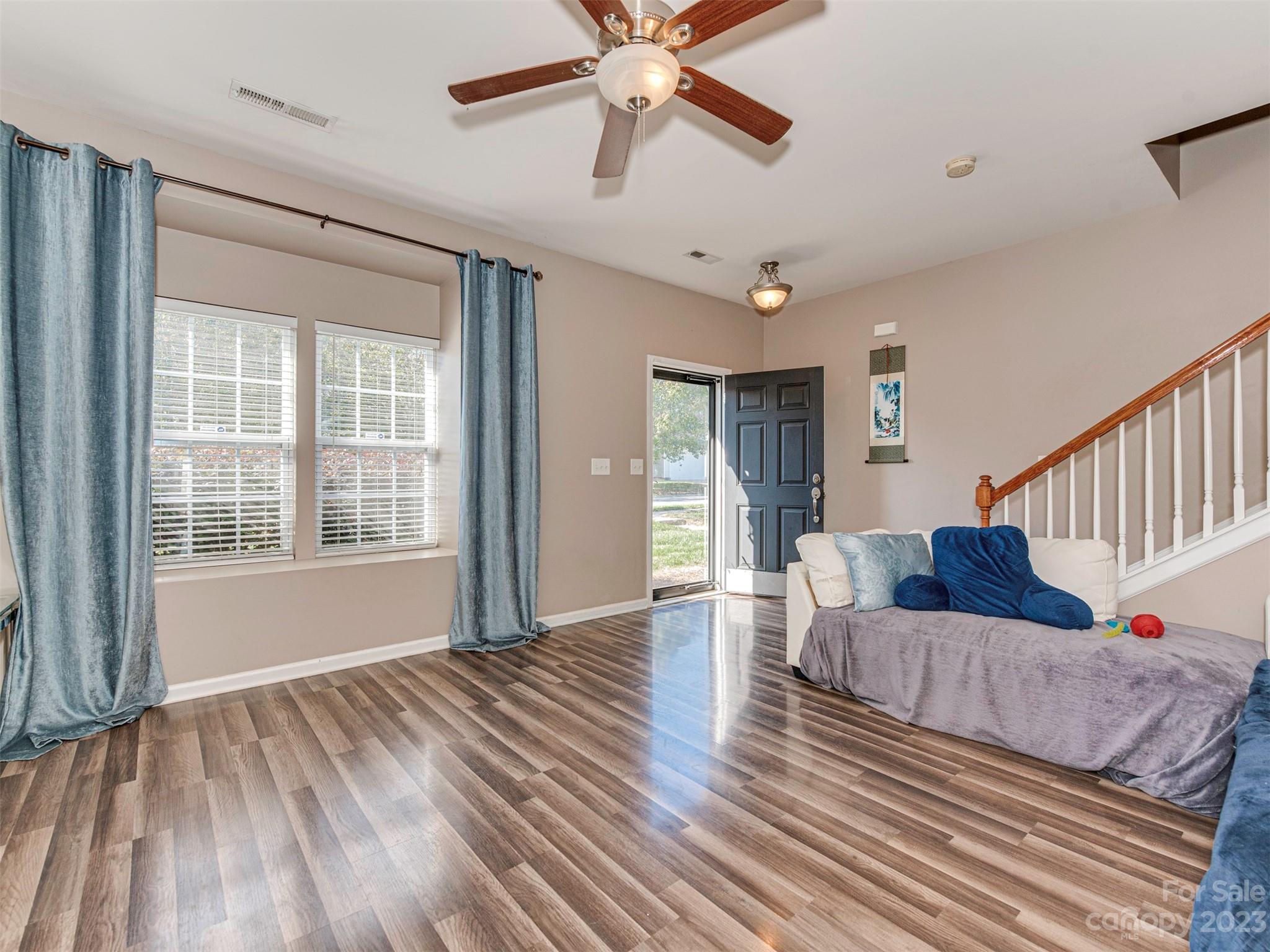 2049 Twilight Lane Monroe, NC 28110 - Photo 12 of 44 a living room with furniture and a wooden floor