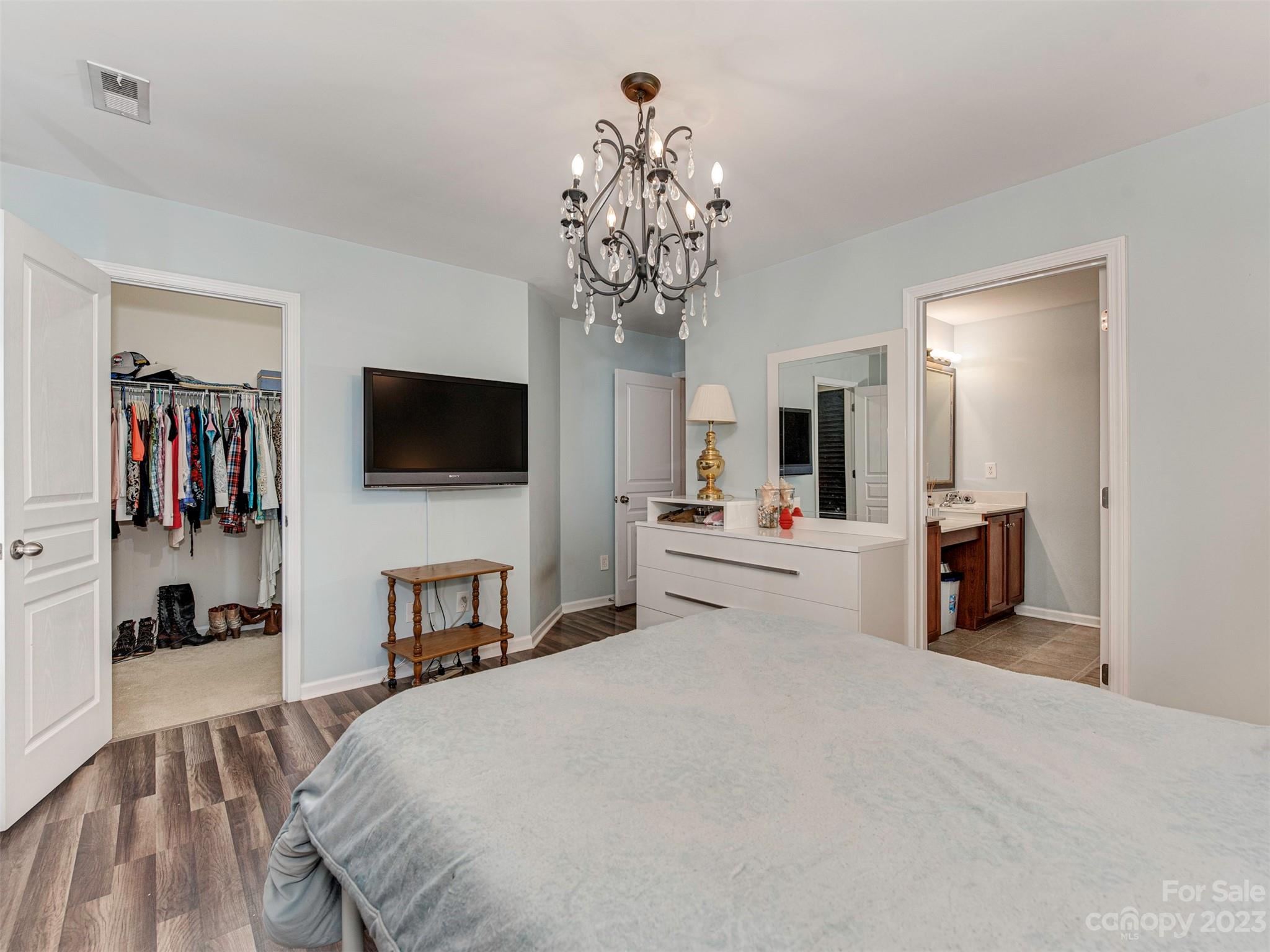 2049 Twilight Lane Monroe, NC 28110 - Photo 21 of 44 a bedroom with a large bed and a flat tv screen on dresser