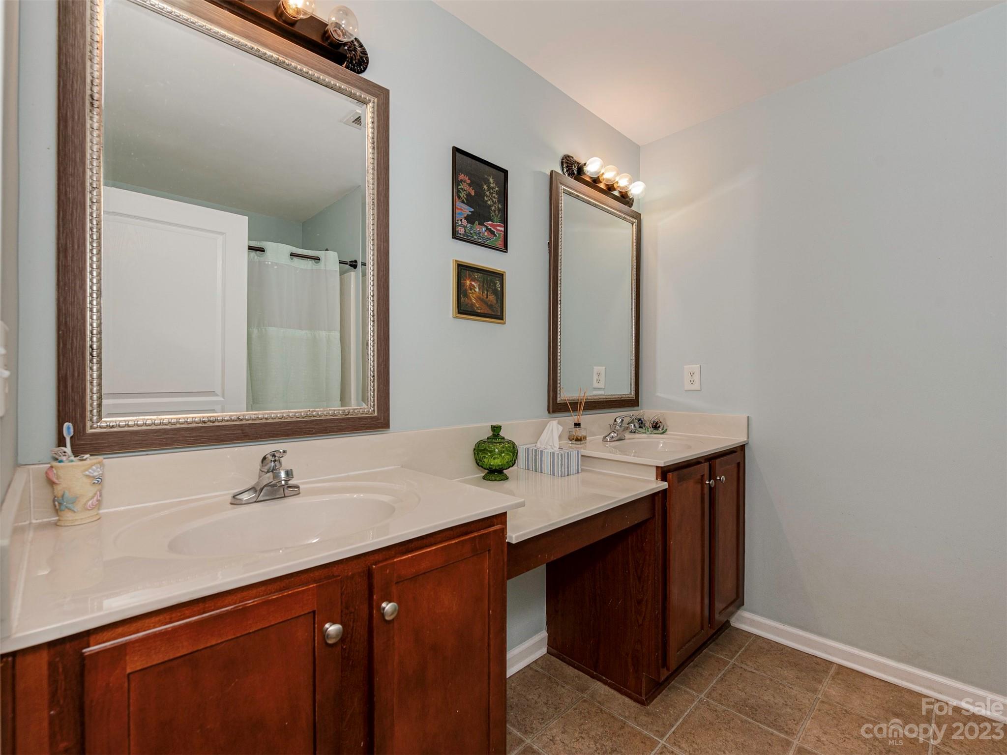 2049 Twilight Lane Monroe, NC 28110 - Photo 24 of 44 a bathroom with a sink double vanity and a mirror