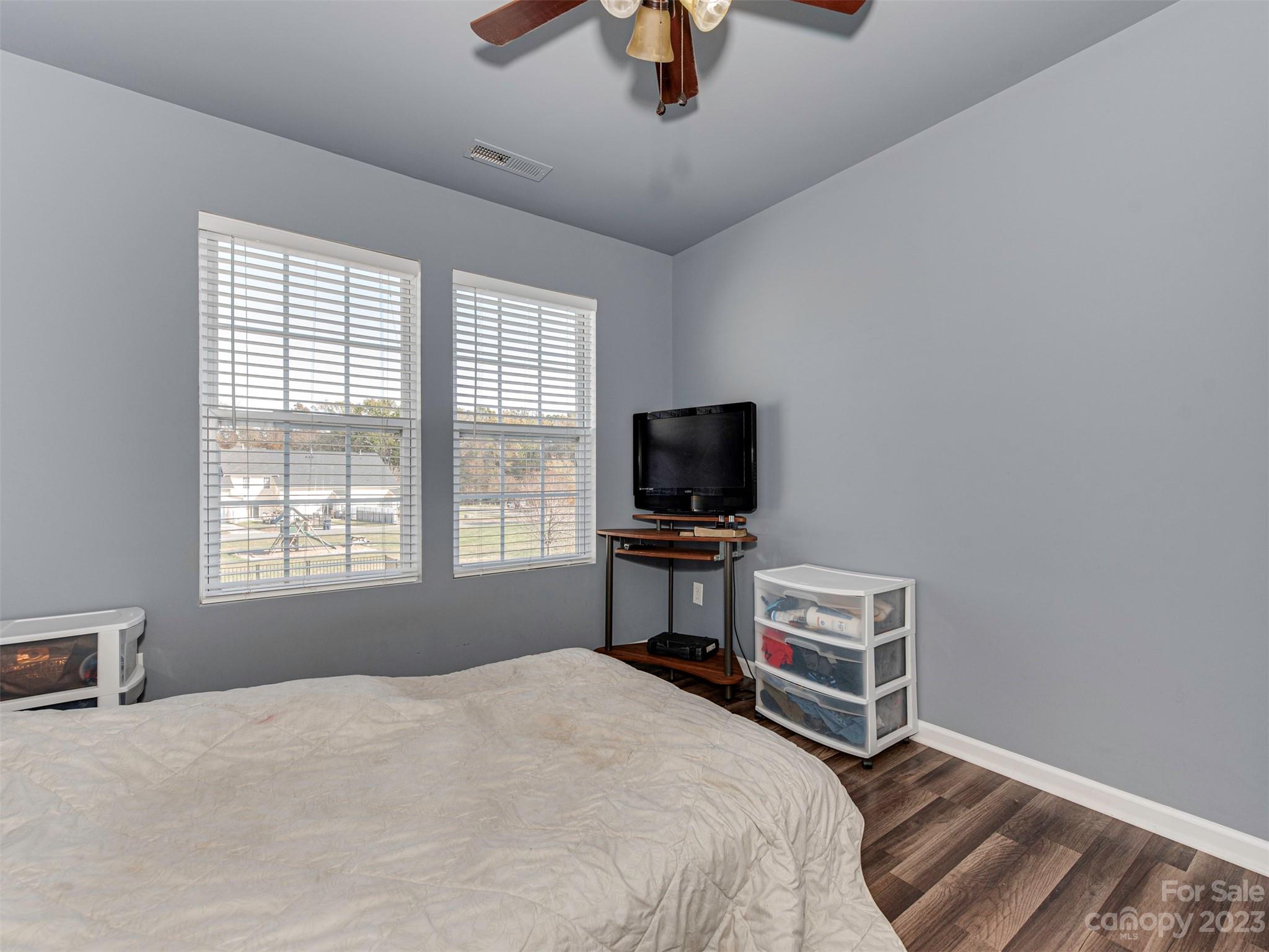 2049 Twilight Lane Monroe, NC 28110 - Photo 25 of 44 a bedroom with a bed and a flat screen tv