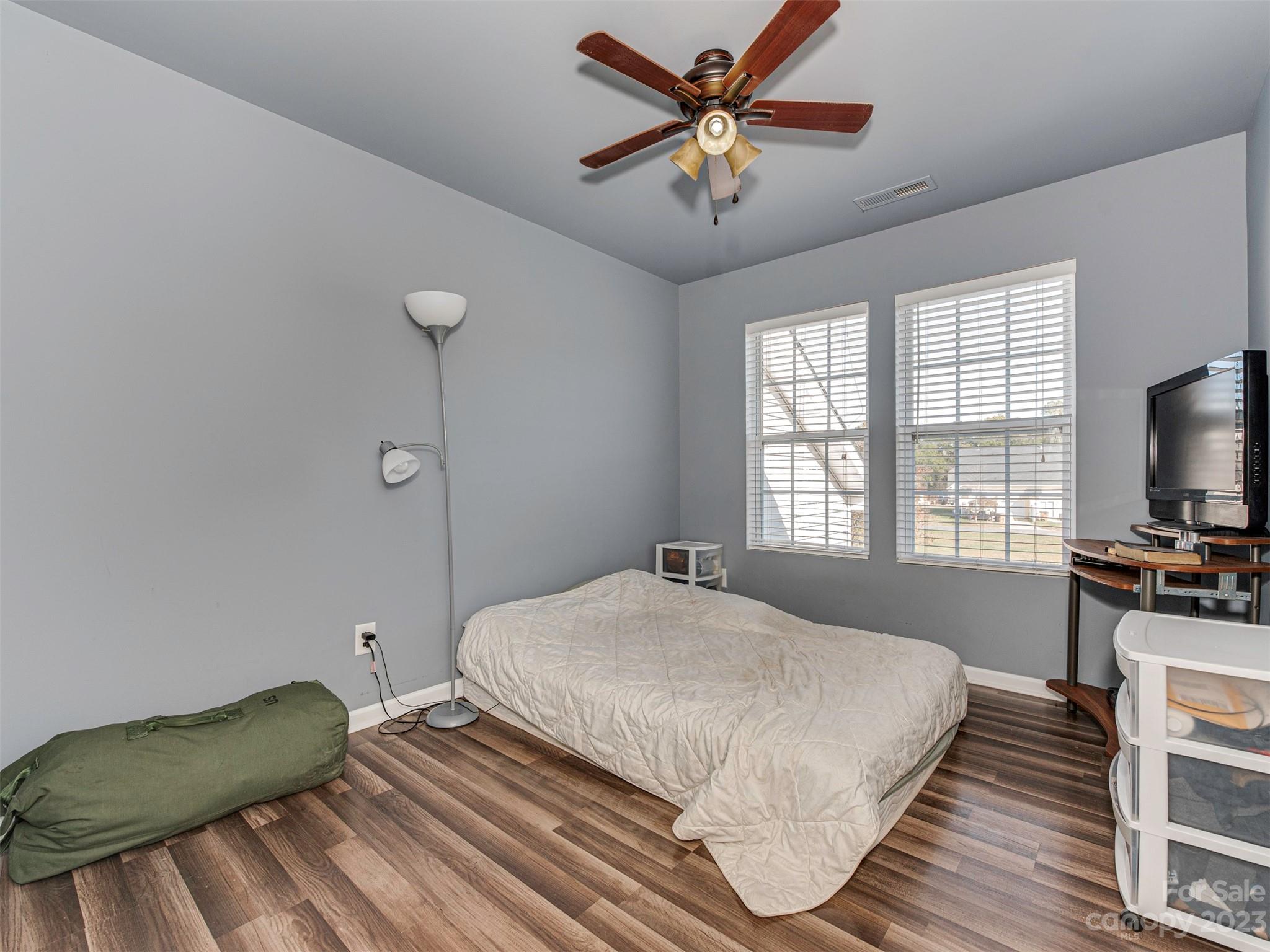 2049 Twilight Lane Monroe, NC 28110 - Photo 26 of 44 a bedroom with a bed and a flat screen tv