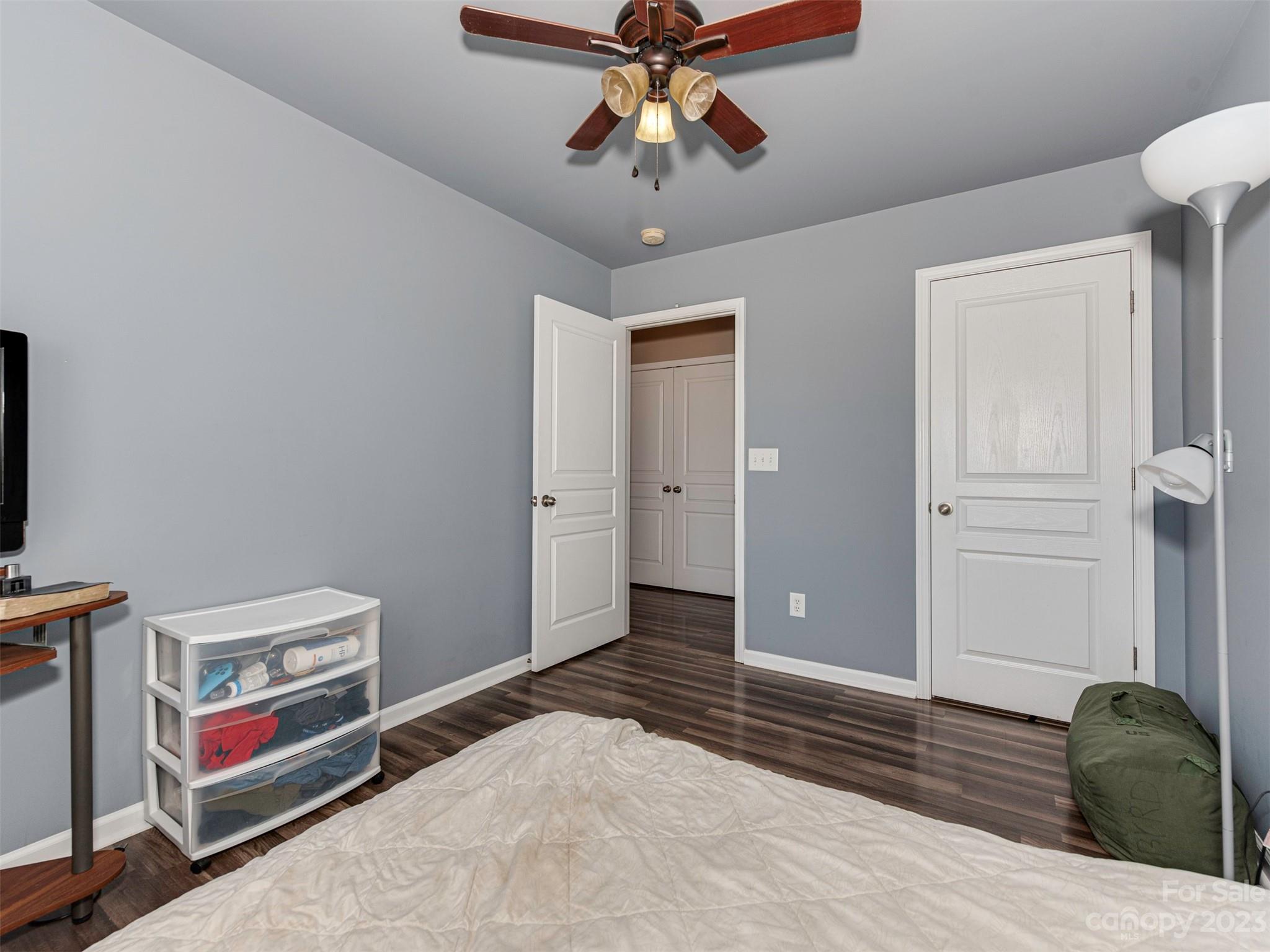 2049 Twilight Lane Monroe, NC 28110 - Photo 27 of 44 a bedroom with a bed and a chandelier fan