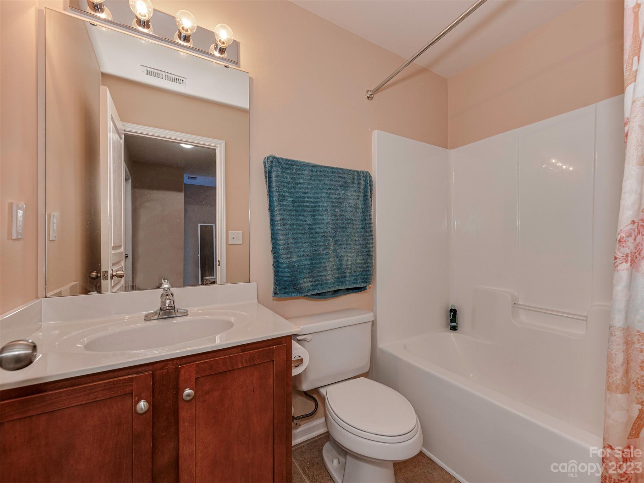 2049 Twilight Lane Monroe, NC 28110 - Photo 28 of 44 a bathroom with a sink a toilet and shower