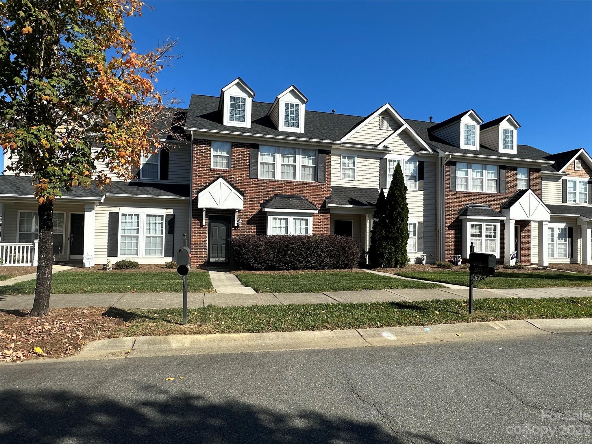 2049 Twilight Lane Monroe, NC 28110 - Photo 3 of 44 a front view of a house with a yard