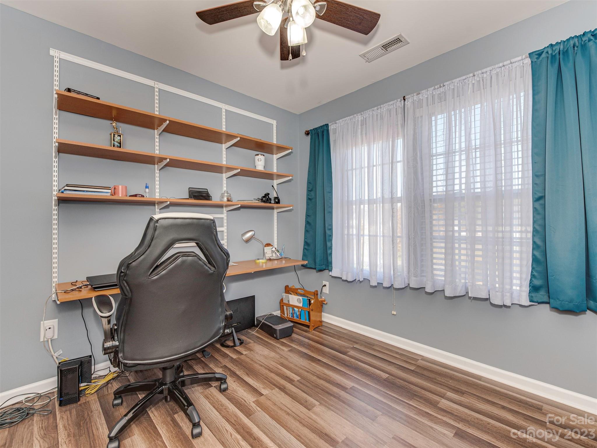 2049 Twilight Lane Monroe, NC 28110 - Photo 31 of 44 a view of a workspace with furniture and a window