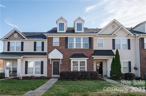 2049 Twilight Lane Monroe, NC 28110 - Photo 4 of 44 a front view of a house with garden