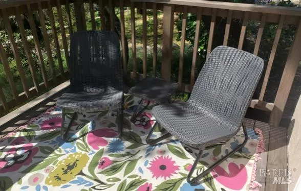 a view of balcony with wooden floor