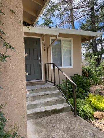 a view of entryway with wooden floor and a potted plant