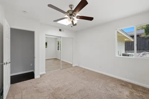 a view of an empty room with a bathroom