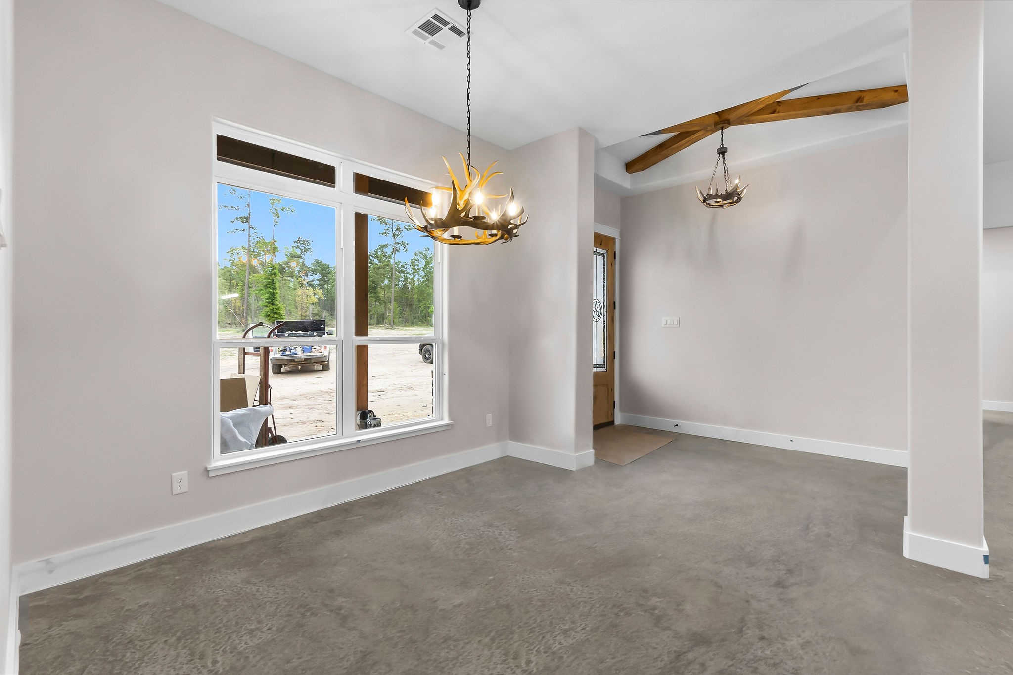 393 Hanson Road Onalaska, TX 77360 - Photo 12 of 38 a view of a big room with a windows and brick walls