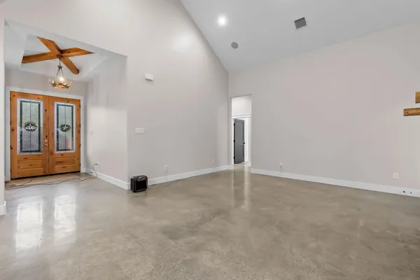 a view of an empty room with a window