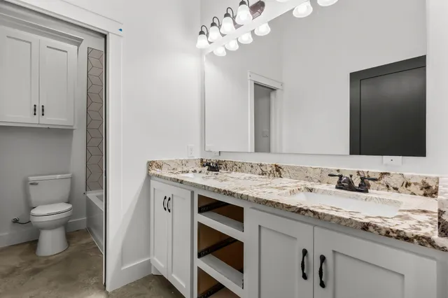 a bathroom with a sink and a toilet