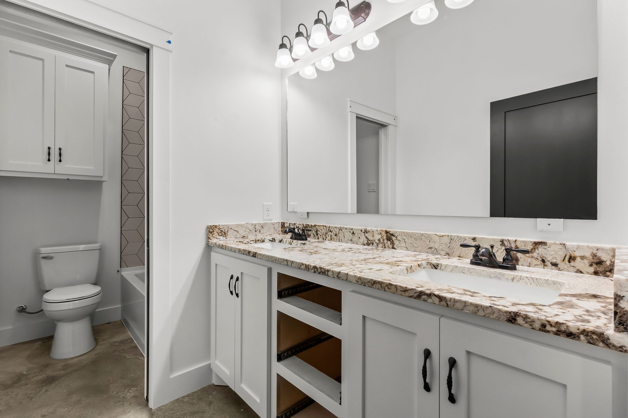 393 Hanson Road Onalaska, TX 77360 - Photo 25 of 38 a bathroom with a sink and a toilet