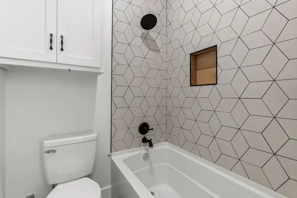 a bathroom with a toilet and a sink