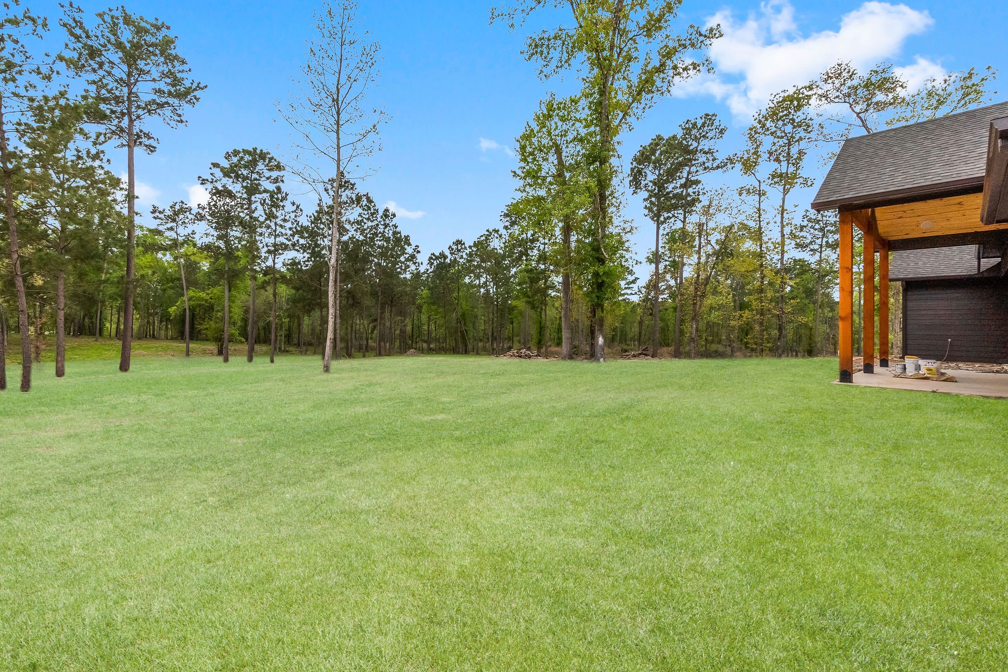 393 Hanson Road Onalaska, TX 77360 - Photo 35 of 38 a view of outdoor space with deck and yard