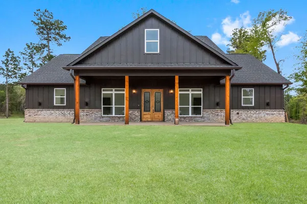 front view of a house with a yard