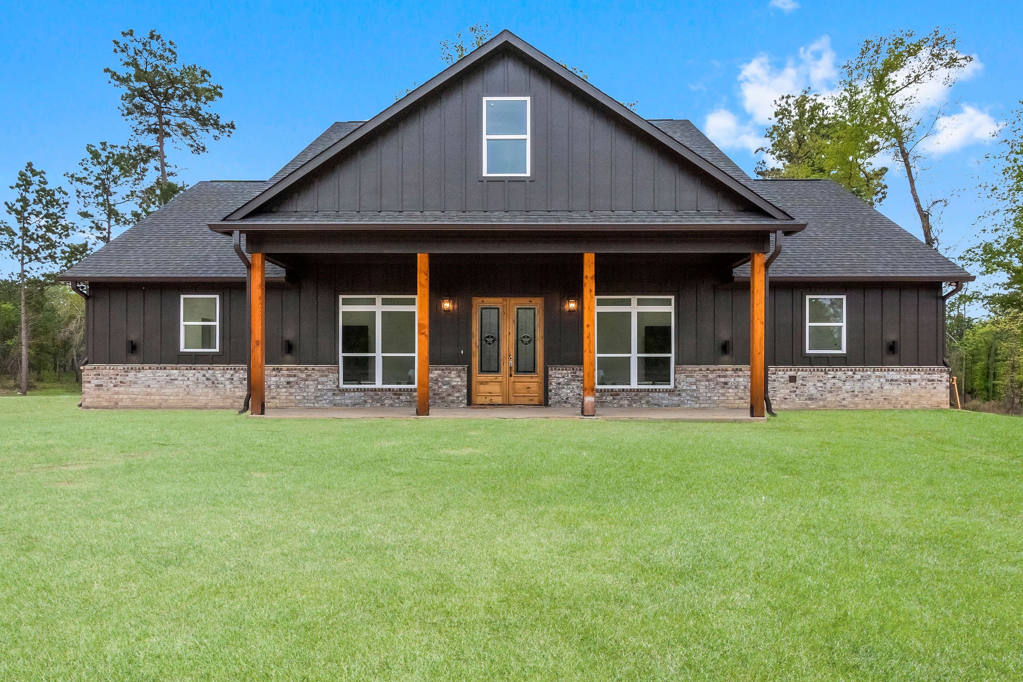 393 Hanson Road Onalaska, TX 77360 - Photo 4 of 38 front view of a house with a yard