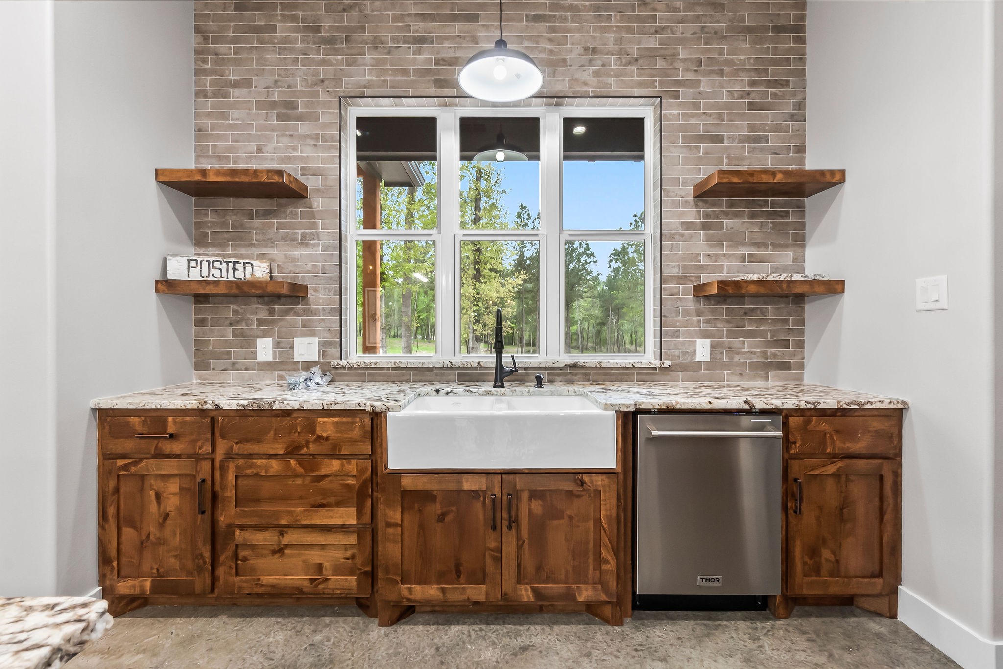 393 Hanson Road Onalaska, TX 77360 - Photo 8 of 38 a kitchen with stainless steel appliances granite countertop a stove and a sink