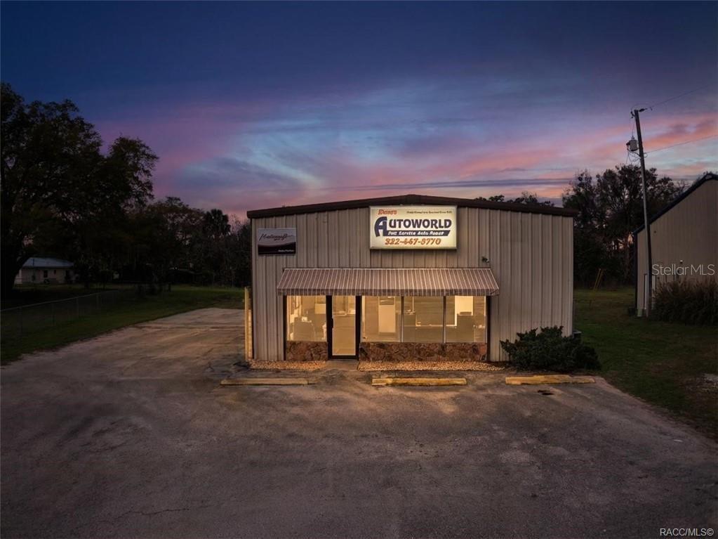8 Highway 19 Inglis, FL 34449 - Photo 1 of 37 a front view of a house with a yard