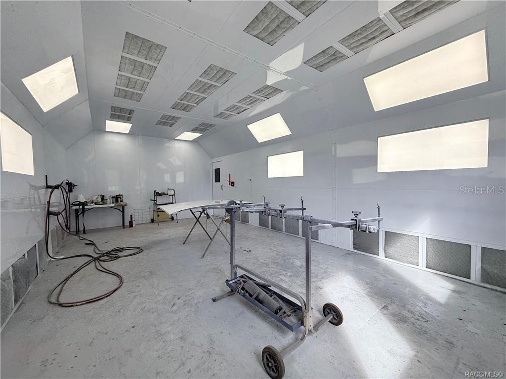 8 Highway 19 Inglis, FL 34449 - Photo 11 of 37 a room with lots of chairs and mirrors