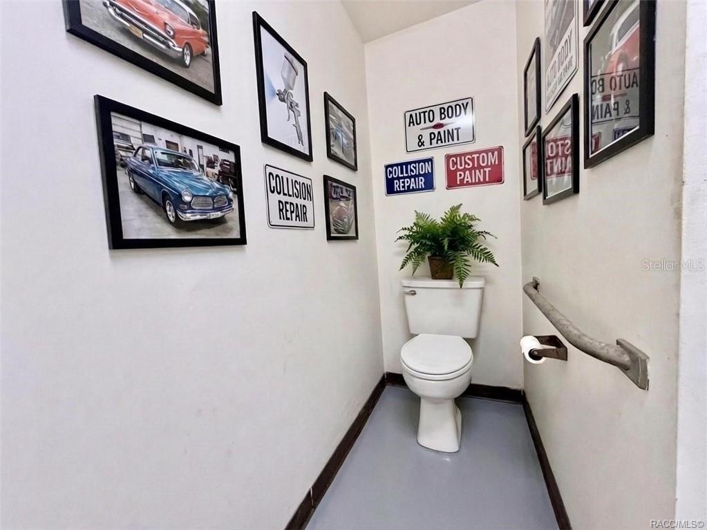 8 Highway 19 Inglis, FL 34449 - Photo 9 of 37 a bathroom with a toilet and a shower