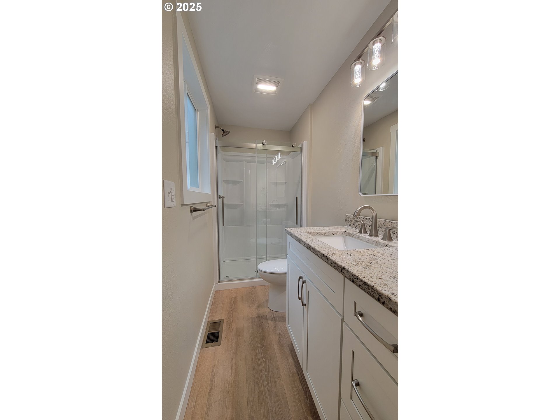 552 West D Street Springfield, OR 97477 - Photo 13 of 29 a spacious bathroom with a granite countertop sink a toilet and shower