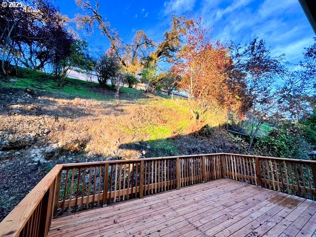 552 West D Street Springfield, OR 97477 - Photo 20 of 29 a view of deck with wooden floor and trees