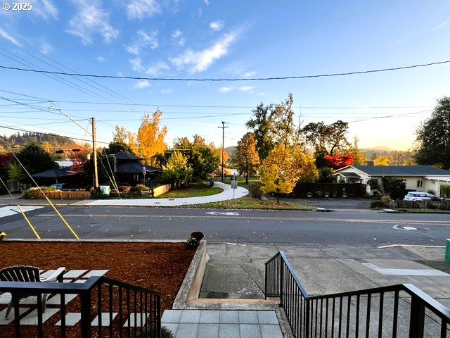 552 West D Street Springfield, OR 97477 - Photo 23 of 29 a view of a patio with table and chairs and potted plants